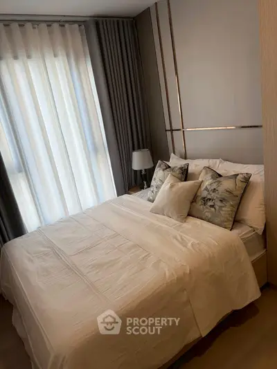 Elegant bedroom with luxurious bedding and stylish decor, perfect for a cozy retreat.