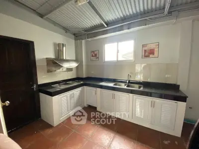 Spacious kitchen with modern appliances and ample natural light