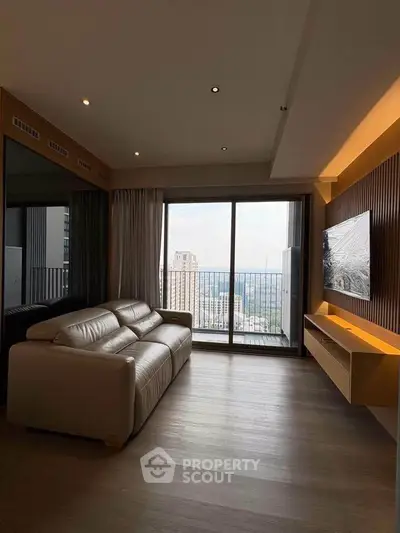 Modern living room with large window and city view, featuring sleek furniture and stylish decor.