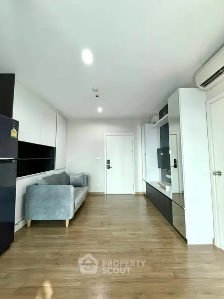 Modern living room with sleek design and wooden flooring