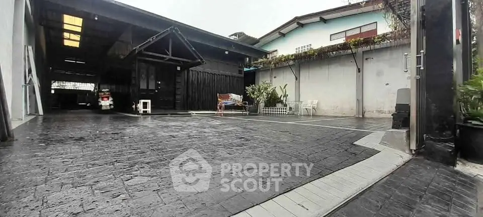 Spacious residential driveway with modern design and ample parking space.