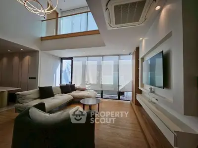 Luxurious modern living room with high ceilings and stylish decor