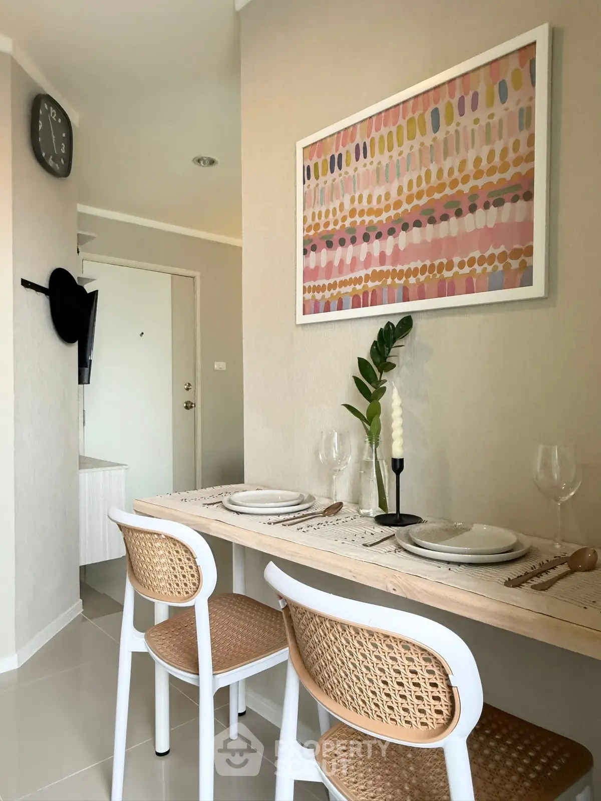 Chic dining area with modern decor and stylish seating in a cozy apartment.