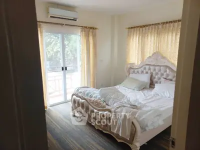 Luxurious bedroom with elegant bed and balcony access
