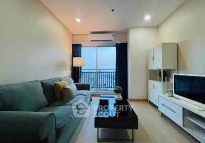 Modern living room with cozy sofa, sleek TV unit, and balcony view in stylish apartment.