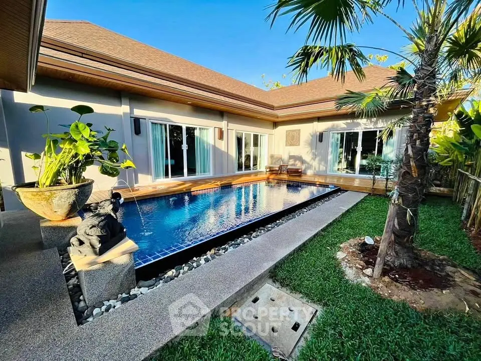 Luxurious villa with private pool and tropical garden, perfect for relaxation and entertaining.