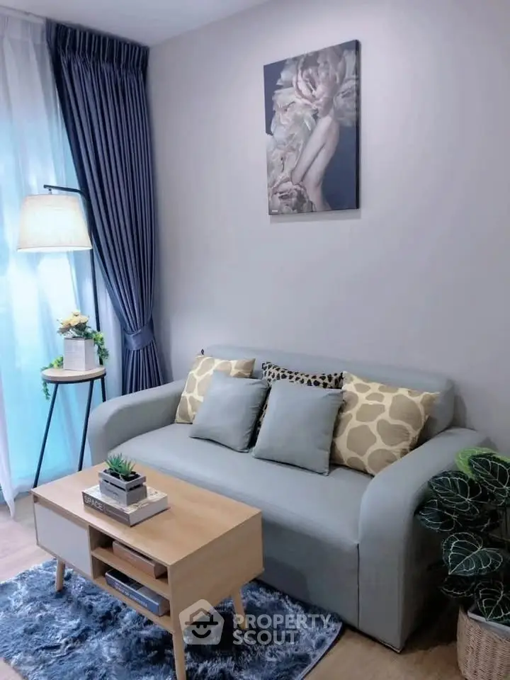 Chic living room with stylish sofa, elegant decor, and natural light, perfect for modern urban living.