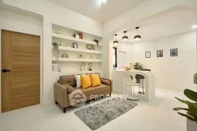 Modern living room with cozy sofa and stylish open kitchen layout