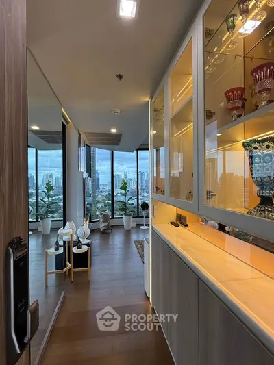 Luxurious high-rise apartment with stunning city view and elegant interior design.