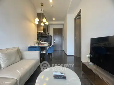 Modern living room with open kitchen and elegant dining area