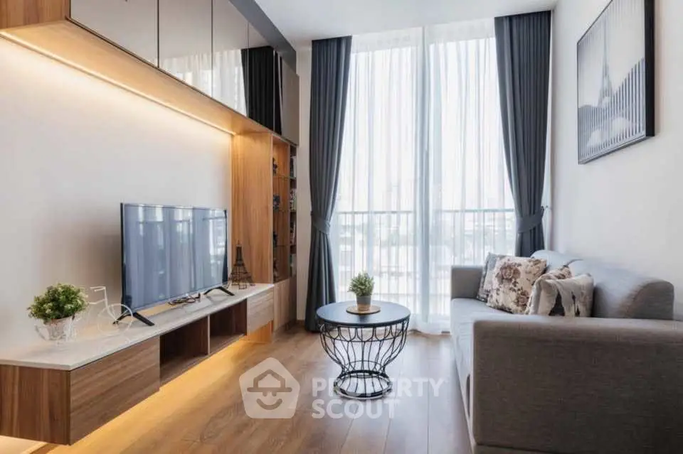 Modern living room with stylish decor and large window view