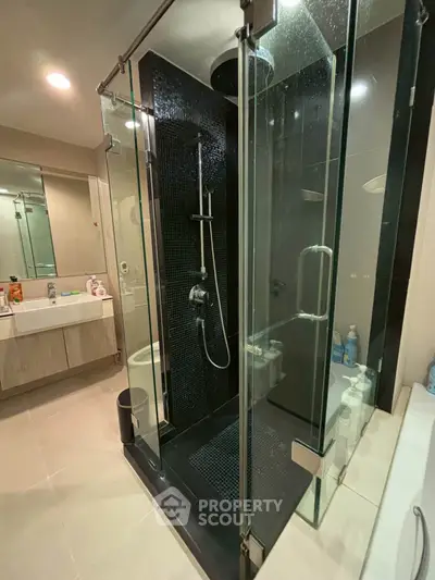 Modern bathroom with glass shower and sleek fixtures