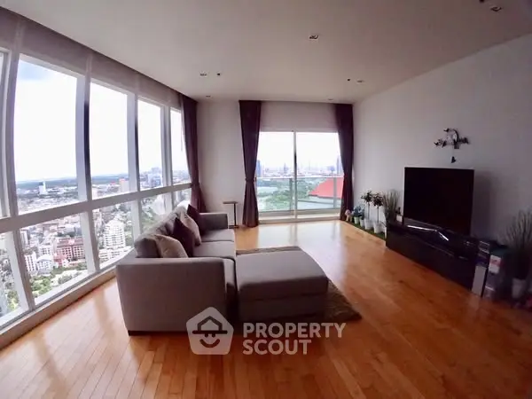 Spacious living room with panoramic city view and modern decor