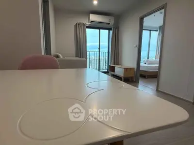 Modern apartment interior with open layout and balcony view