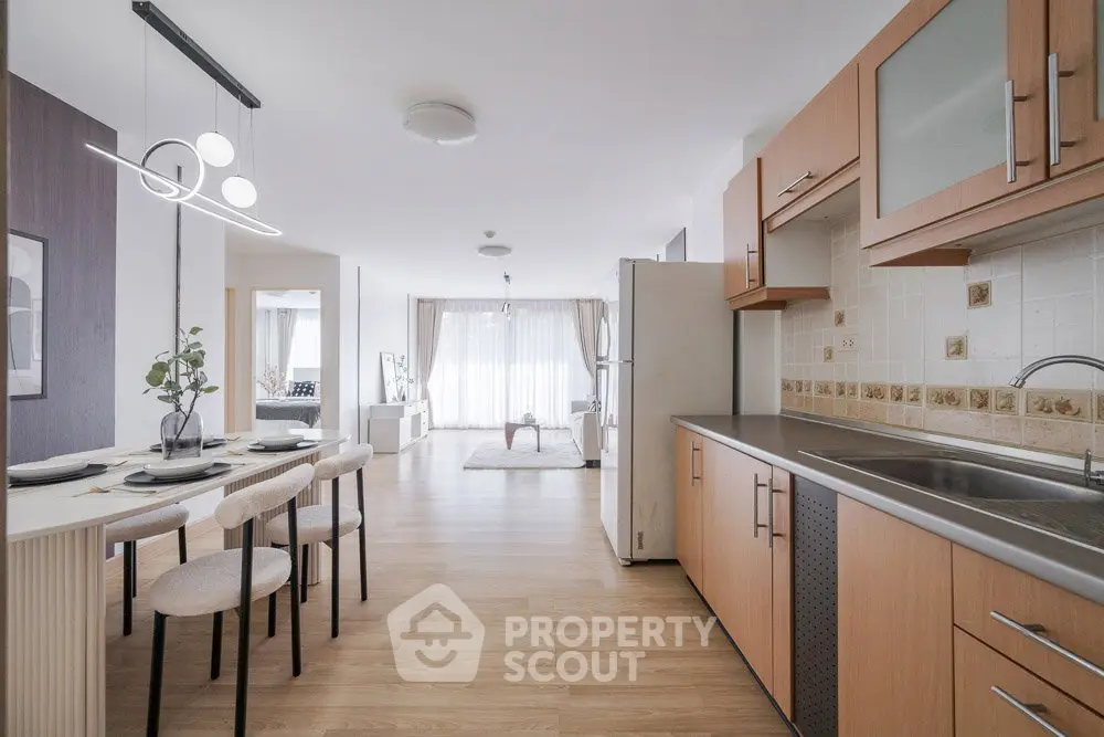Spacious open-layout kitchen and dining area with modern design and natural light.