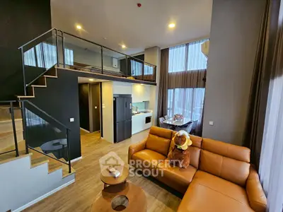 Modern loft apartment with open layout, stylish furniture, and high ceilings for luxurious living.
