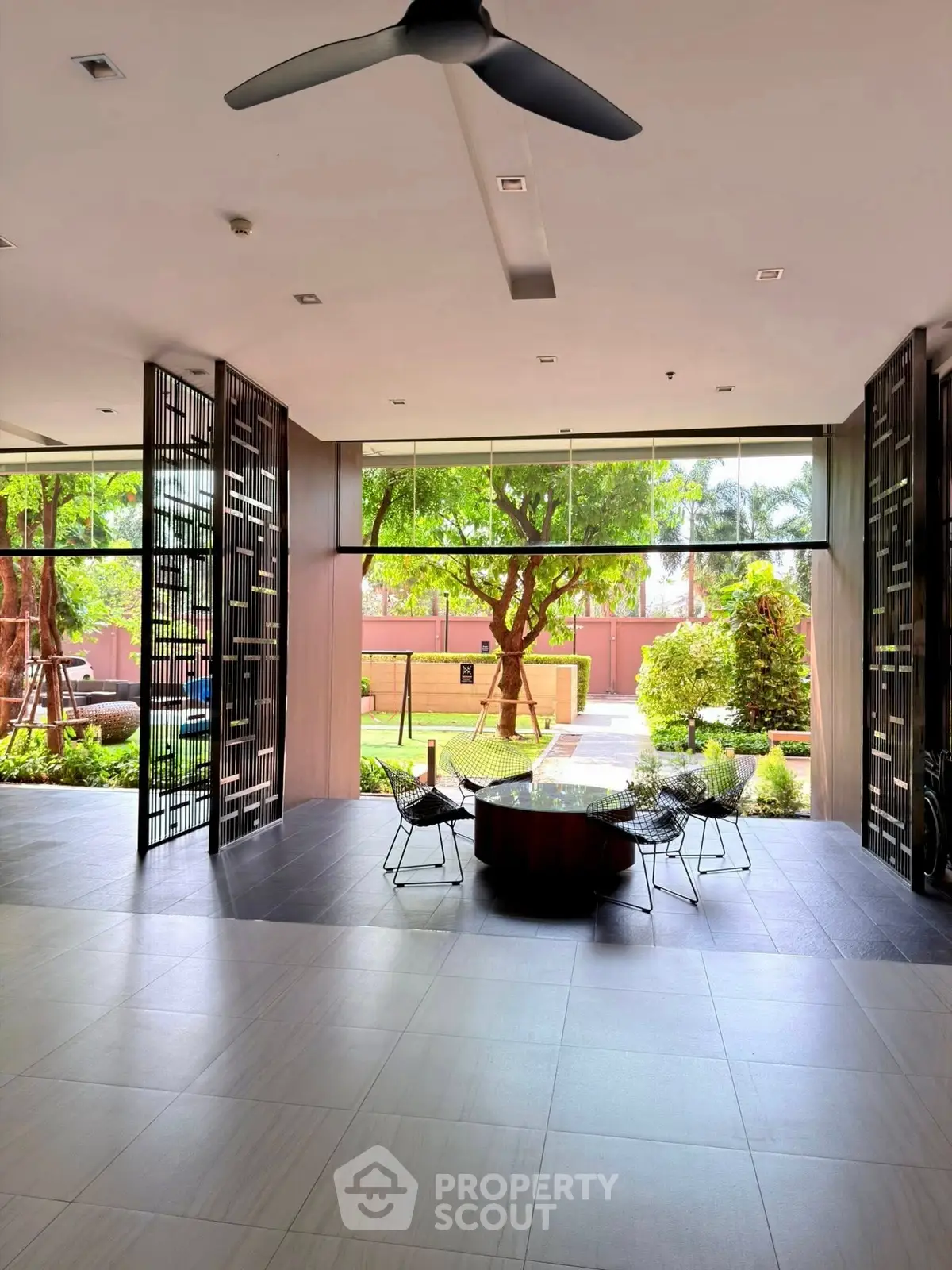 Spacious modern lobby with garden view and stylish seating area