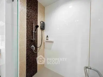 Modern bathroom with sleek shower design and stylish tile accents