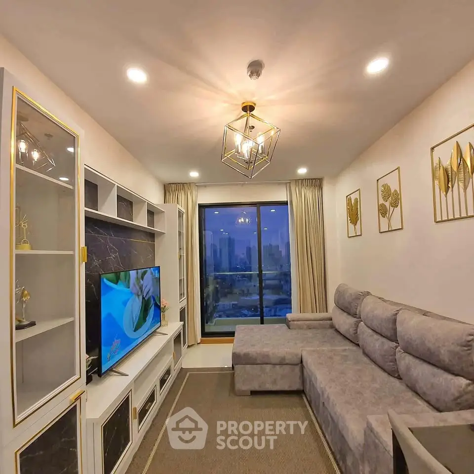 Luxurious living room with modern decor and stunning city view from large window.