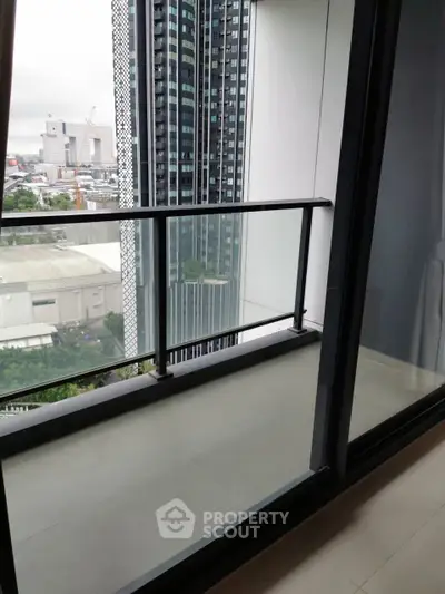 Modern high-rise balcony with cityscape view, ideal for urban living.