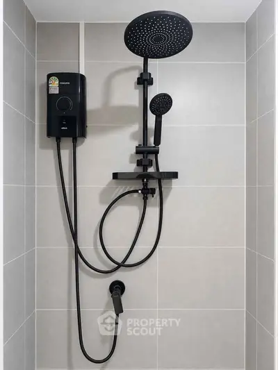 Modern bathroom shower with sleek black fixtures and tiled walls