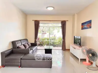 Spacious living room with modern sofa and large window view