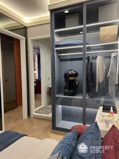 Modern bedroom with stylish closet and elegant decor