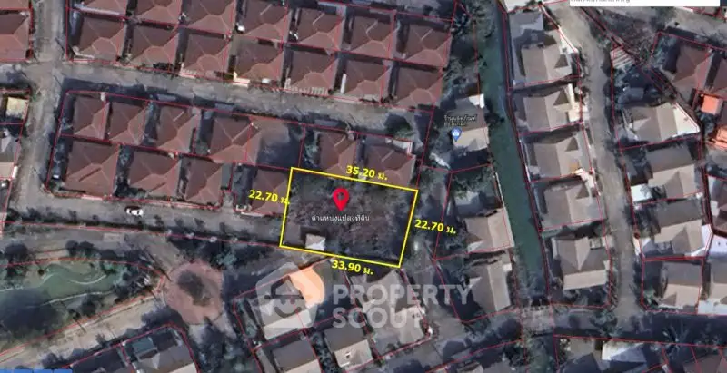 Aerial view of residential neighborhood with plot boundaries marked in yellow.