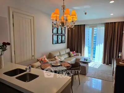 Chic modern living room with elegant chandelier and cozy seating area, perfect for urban living.