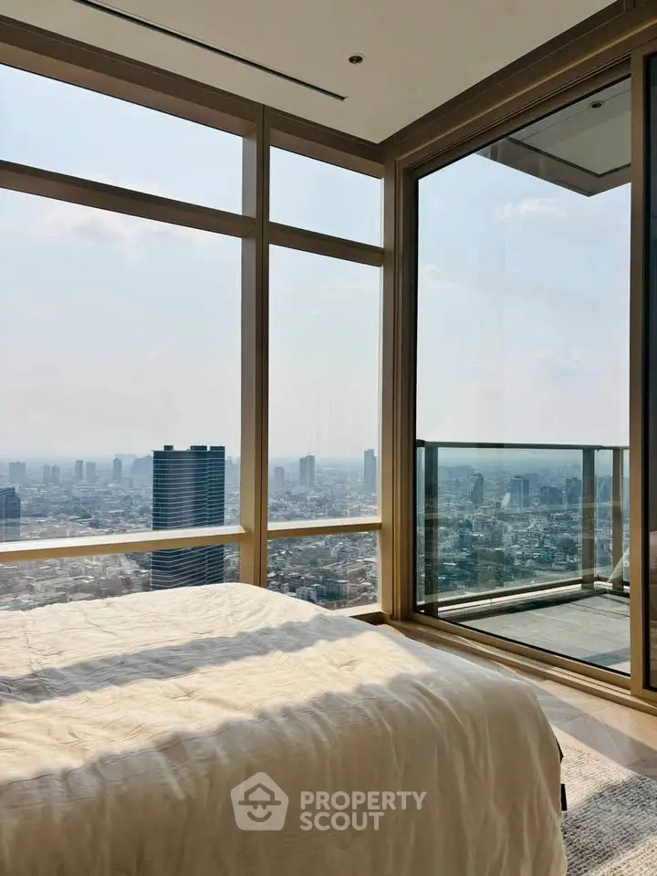Luxurious bedroom with stunning city view and large windows