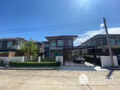 Modern two-story house with carport in a sunny suburban neighborhood