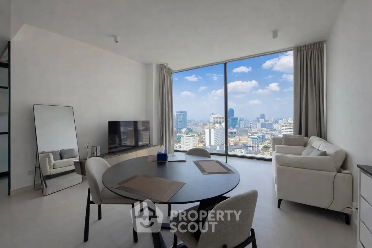 Modern living room with panoramic city view, stylish furniture, and large windows.
