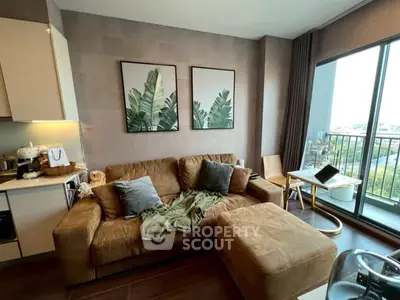 Cozy living room with brown sofa and balcony view in modern apartment