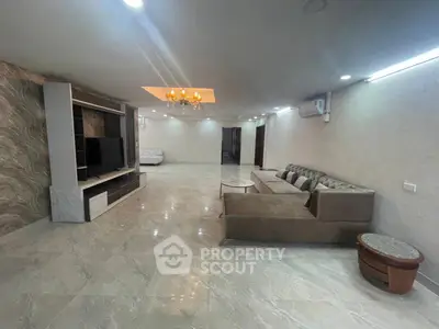 Spacious modern living room with elegant decor and ample natural light