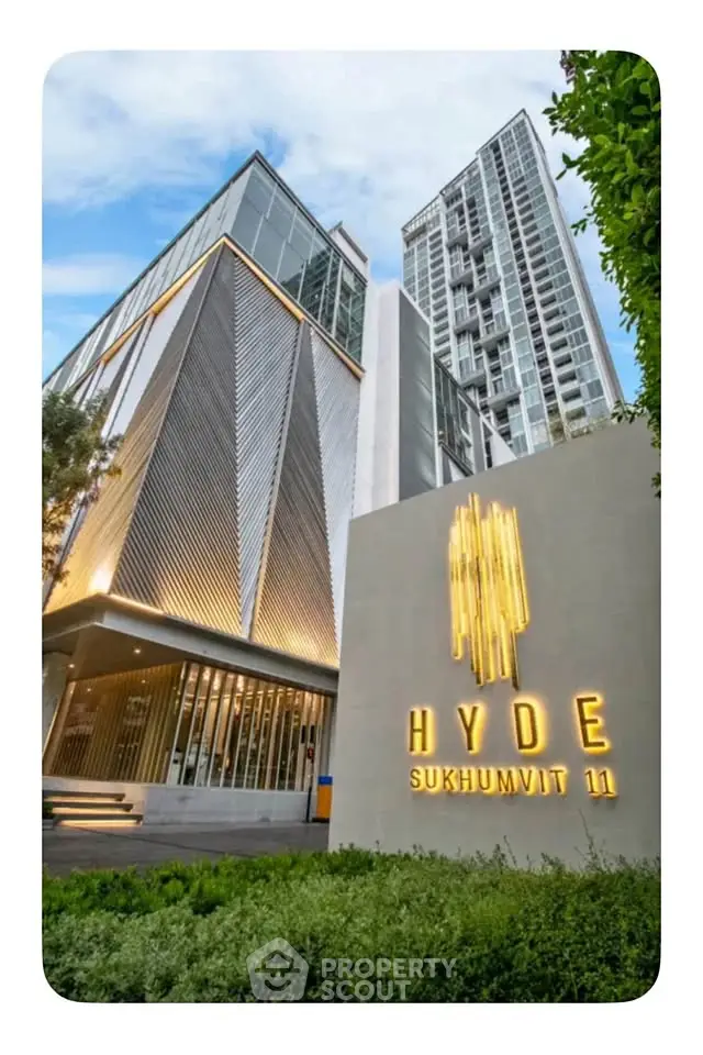 Stunning modern high-rise building at Hyde Sukhumvit 11 with sleek architectural design.