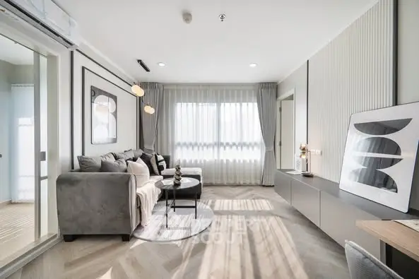 Modern living room with stylish decor and ample natural light