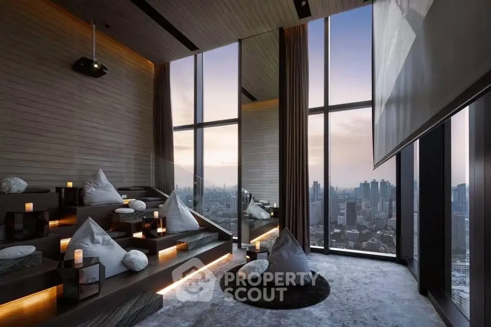 Luxurious high-rise living room with panoramic city views and modern decor.