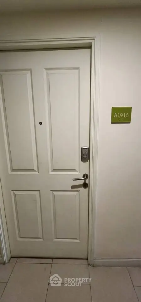Modern apartment entrance with electronic lock and room number A1916.