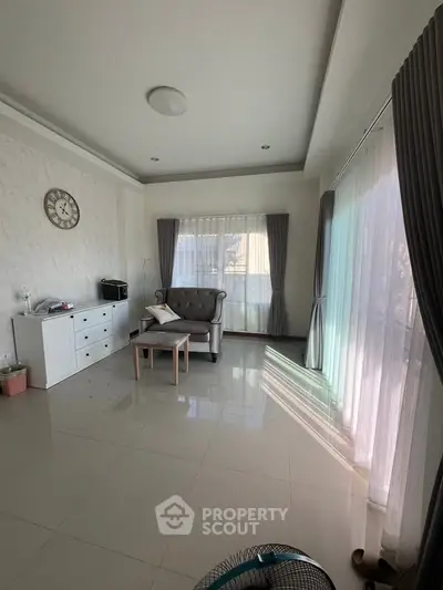 Spacious living room with elegant decor and natural light