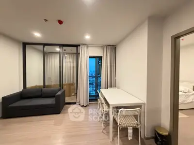 Modern apartment interior with cozy living room and dining area, featuring a balcony with city view.