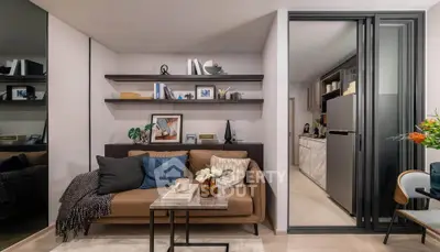 Modern living room with cozy sofa and open kitchen layout