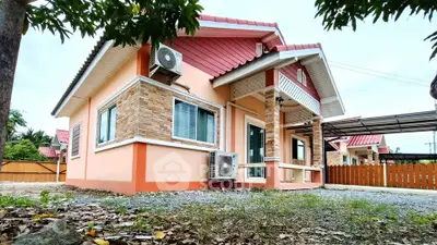 Charming single-story home with modern exterior and air conditioning units, perfect for comfortable living.