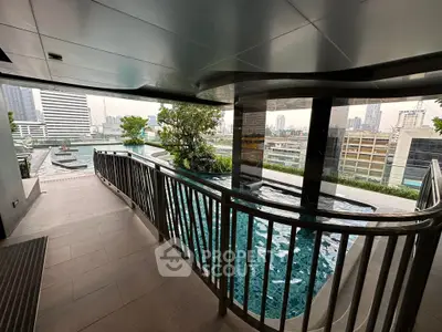 Luxurious rooftop pool with stunning city views in modern high-rise building.