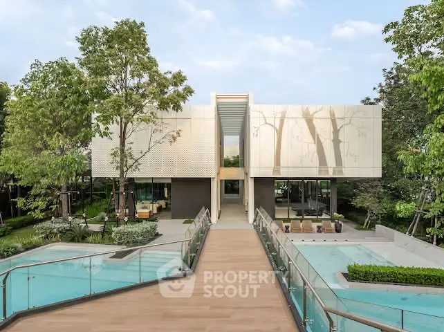 Luxurious modern house with pool and lush garden, featuring sleek architecture and serene surroundings.