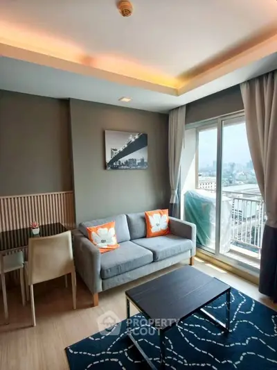 Modern living room with city view, cozy sofa, and stylish decor in a high-rise apartment.