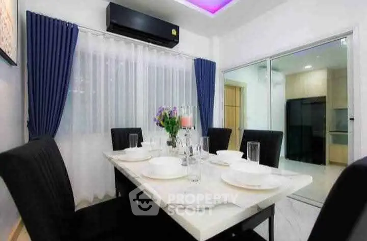 Modern dining area with elegant decor and ambient lighting