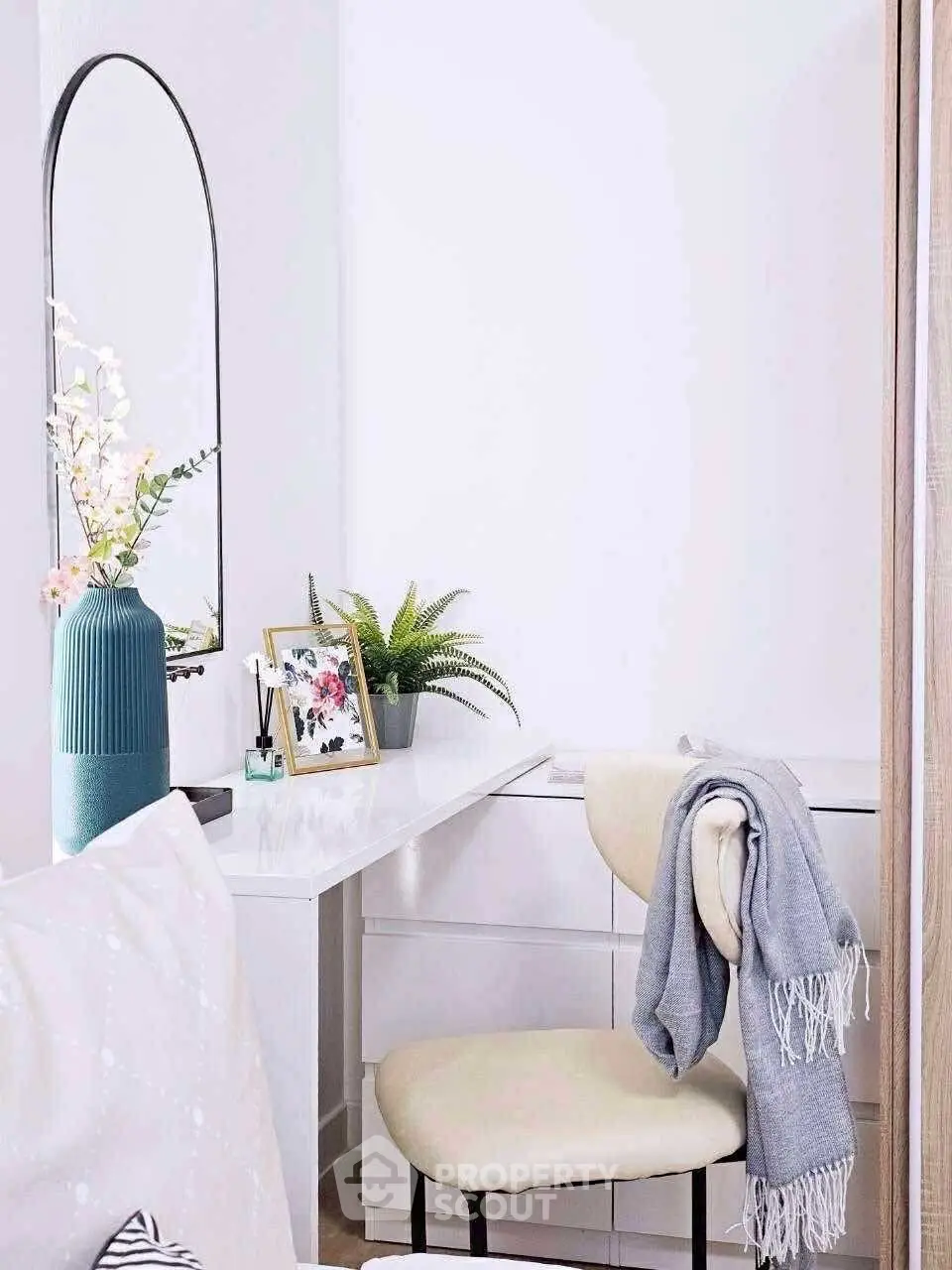 Chic study nook with modern decor and cozy chair in bright interior.