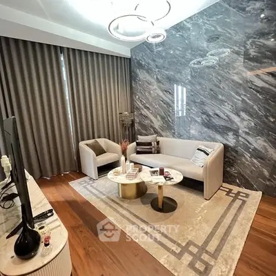 Luxurious living room with marble accent wall and modern furniture
