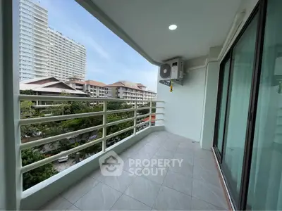 Spacious balcony with city view in modern apartment
