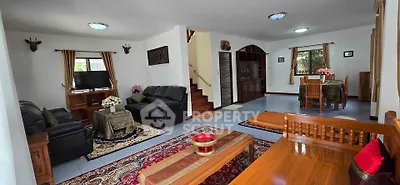 Spacious living room with elegant decor and cozy seating area